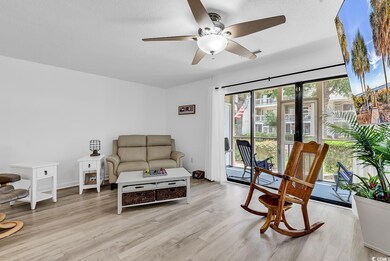 Living area featuring a ceiling fan and light wood-type flooring