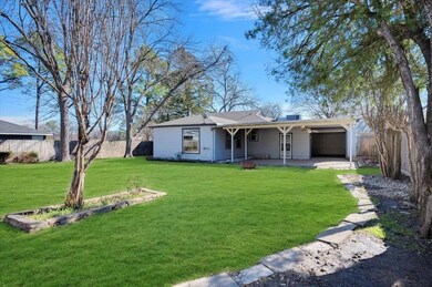 Ranch-style home with a front yard