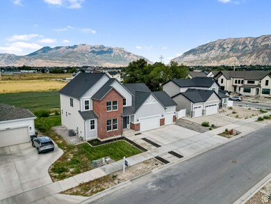 View of mountain backdrop featuring nearby suburban area