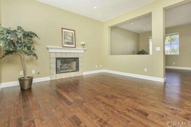 Family Room has charming fireplace to cozy up to i
