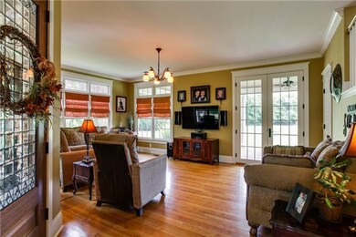 Another view of living room showing all of the win