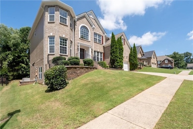 Traditional-style house featuring a front lawn and brick siding