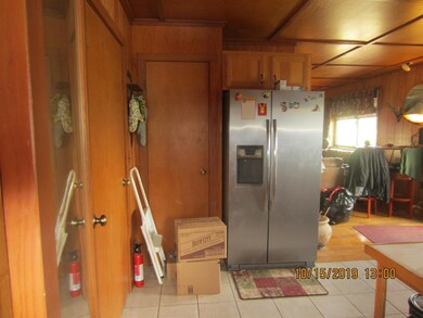 ANOTHER VIEW OF KITCHEN WITH VERY NICE STAINLESS STEEL REFRID..WHICH REMAINS