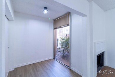 Empty room featuring a textured ceiling, baseboard