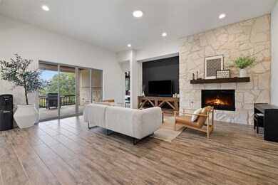 Living room featuring a fireplace, recessed light