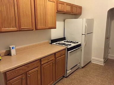 2nd Floor Kitchen with gas stove, refrigerator and plenty of Cabinet space.