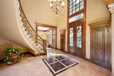 Grand Entry with curved staircase, 10' tall Victorian doors out of the Presidential Hotel