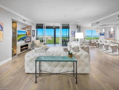 Living room with wood-type flooring, a notable cha