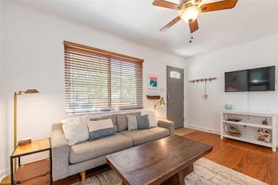 Living room featuring wood finished floors, ceili
