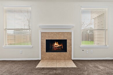 The inviting fireplace becomes a focal point that