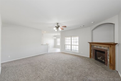 Spacious living room with new carpet.