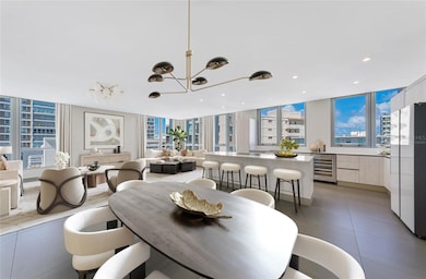 Kitchen and Great Room - This image has been virtually staged and does not reflect the current state of the property