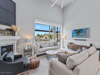 Living area with a high ceiling, a glass covered f