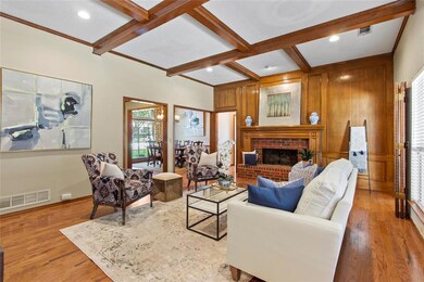 The original wood paneled wall with brick fireplac