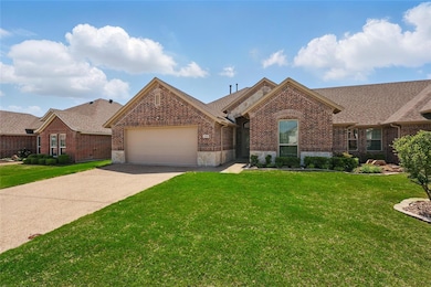 Single story home featuring roof with shingles, a 