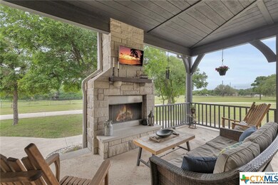 Large FRONT wrap around patio with wood burning fi