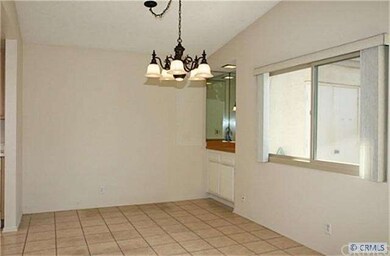 Large dining room with tile flooring, vaulted ceil