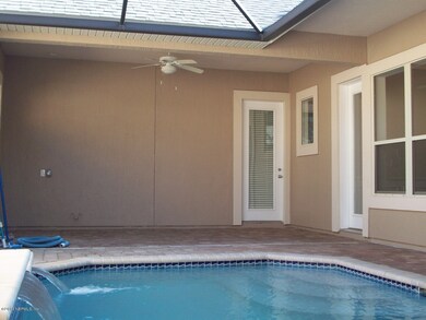 Lounging Area by Pool & Doors to House