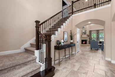 The iron spindles and wood accents make this staircase standout like a work of art. The wall near the stairs is a perfect spot for your favorite furniture piece and a few decorations.