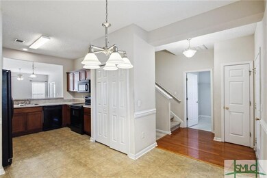 The kitchen highlights abundant cabinetry.