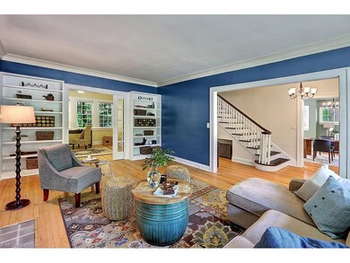 Pocket doors separate the living room from the sun