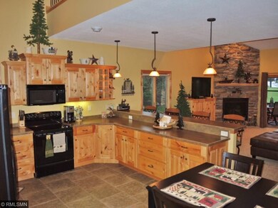 Here is the kitchen with hickory cabinets and lots