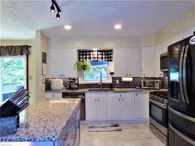 Nice and bright kitchen with granite countertops
