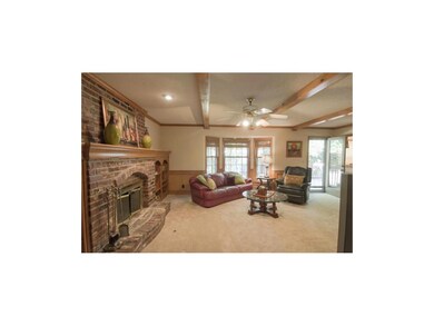 COZY FAMILY ROOM OFF OF THE KITCHEN WITH FIREPLACE