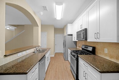 Brand new cabinets with elegant hardware and soft close touch. Granite countertops, and new tile backsplash.