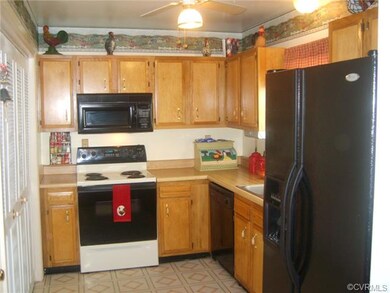 Kitchen with appliances, laundry off of kitchen wi