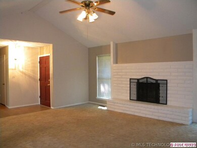 Living with wood burning fireplace.