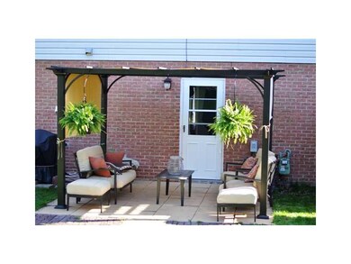 Exterior Back. A new Pergola shades the back Patio