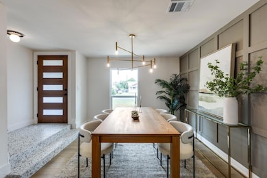 Dining area featuring light wood-style floors and