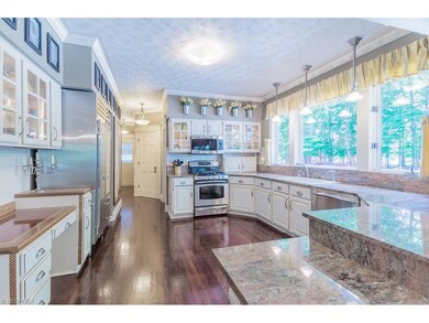 Amazing Kitchen with gorgeous wood floors, granite