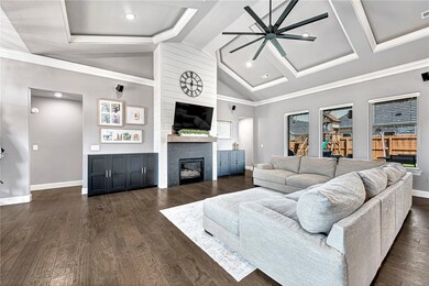 This modern, open living area is surrounded by wal