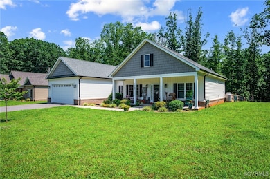 View of front of home with a porch, a front lawn,