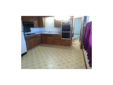 Kitchen with gas cooktop and well maintained cabin