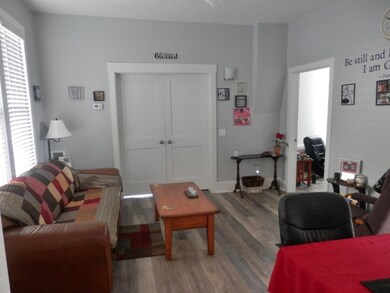 Double doors lead to 3rd bedroom