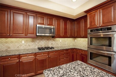 Kitchen with under cabinet lighting, lots of counter space plus a large island.