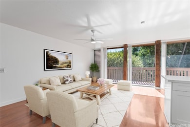 Living room with lots of natural light. Enhanced