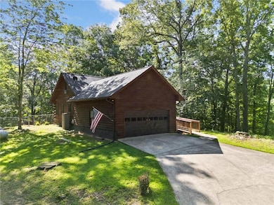 View of side of property featuring a garage