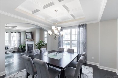 Crown moulding carries on into the dining room whi