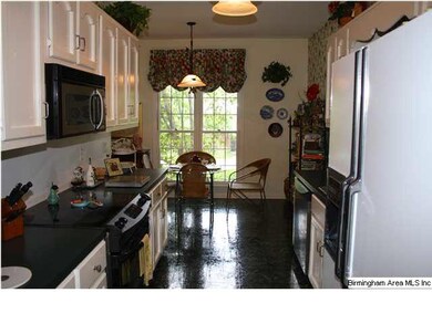 Kitchen with stainless dishwasher, stove and micro