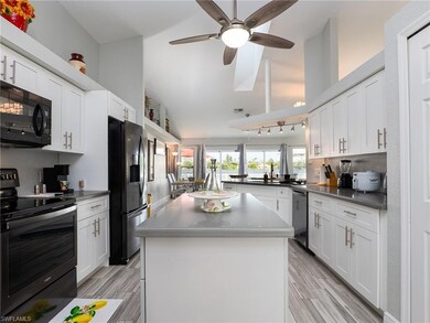 Kitchen featuring a kitchen island, light hardwood