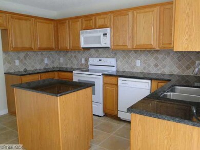 Kitchen. Another view of Kitchen Island with contertop and cermic backsplash