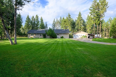Well-kept exterior framed by lush, open lawn