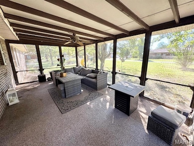 Sunroom with ceiling fan, beamed ceiling, plenty of natural light, and an outdoor hangout area