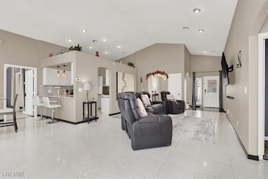 Living area with arched walkways, visible vents, b