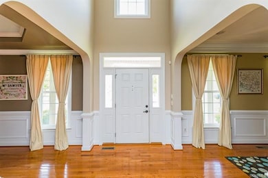 Two story foyer with upper window and oversized ar