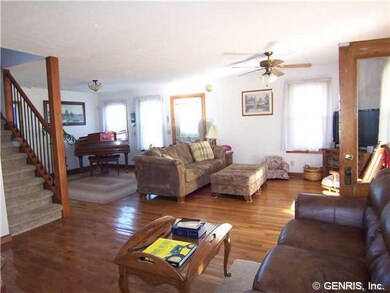 Great Room. Hardwood floor.  Space taken by baby g